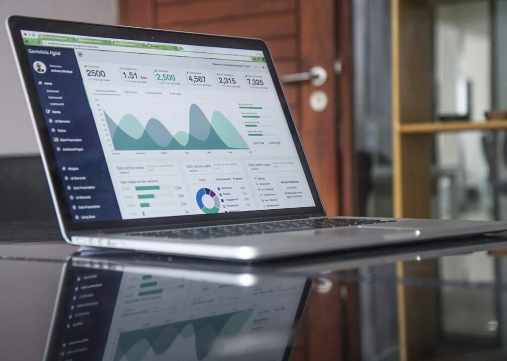 A laptop showing a website analytics dashboard